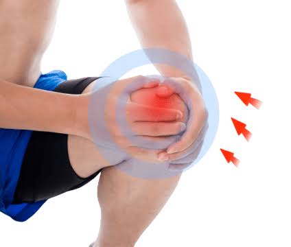 Person holding knee in pain